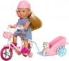 Simba Evi na rowerze z przyczepką